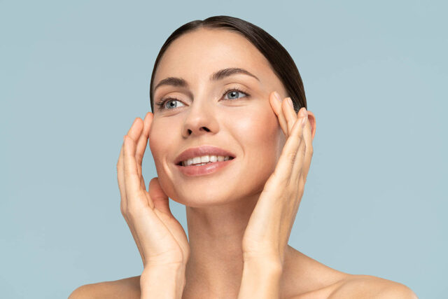 Woman with her hands framing her face