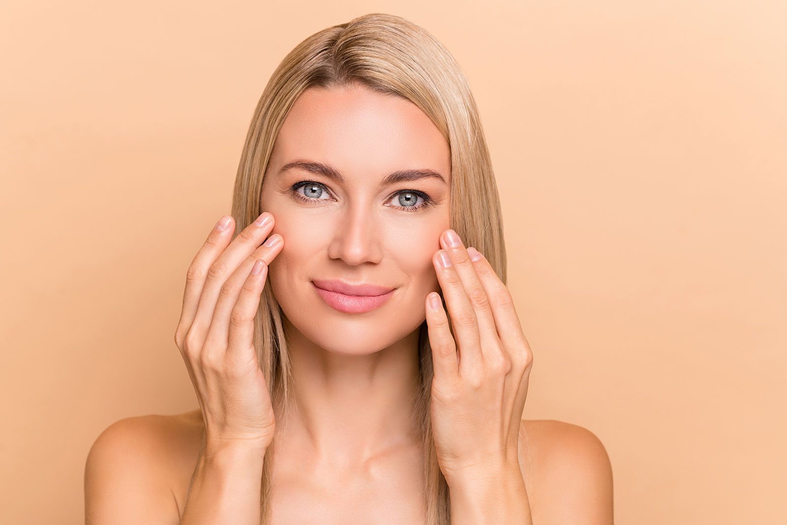 Woman touching her cheeks, skin firming
